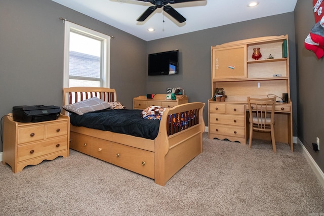 bedroom featuring light carpet and ceiling fan