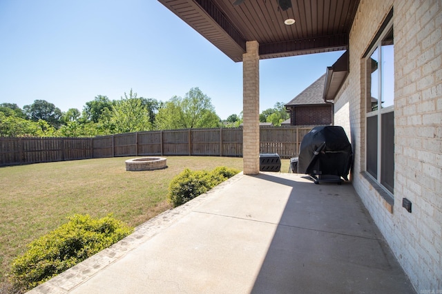 view of patio / terrace featuring grilling area and a fire pit