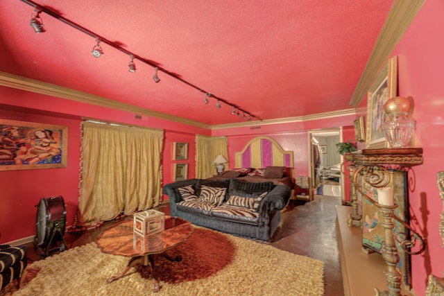 bedroom featuring ornamental molding, rail lighting, and a textured ceiling