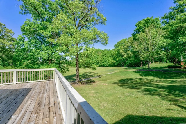 wooden terrace with a yard