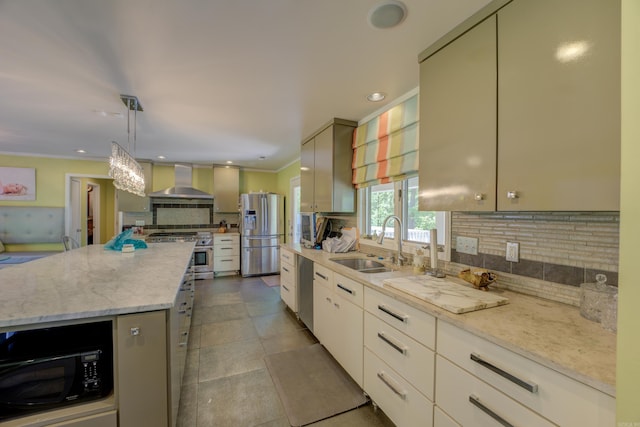 kitchen featuring backsplash, hanging light fixtures, stainless steel appliances, tile flooring, and wall chimney range hood