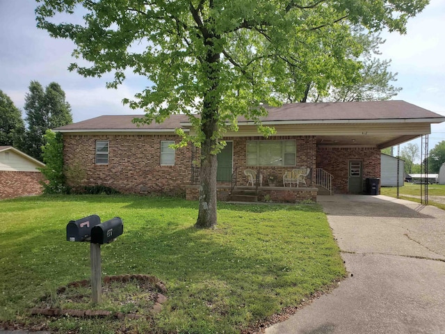 ranch-style house with a front yard and a carport