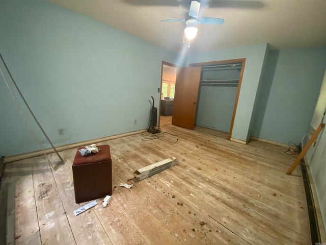 unfurnished bedroom featuring a closet, ceiling fan, and hardwood / wood-style flooring