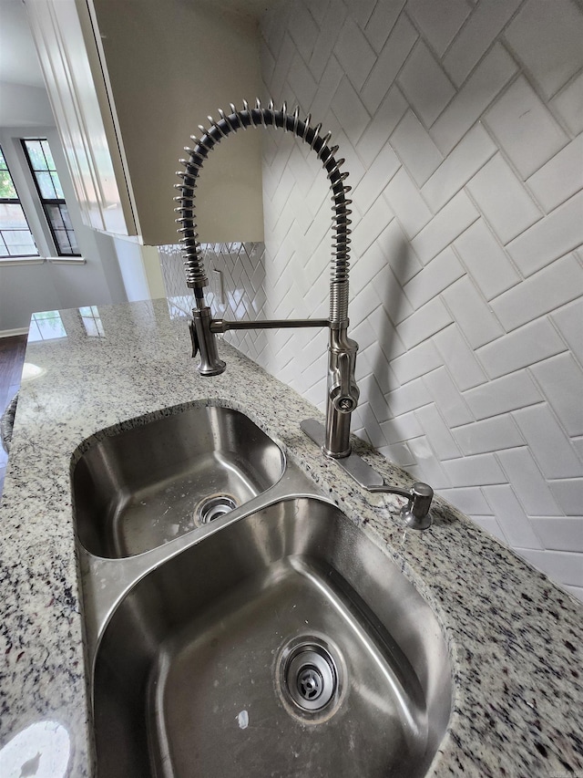 interior details with sink and backsplash