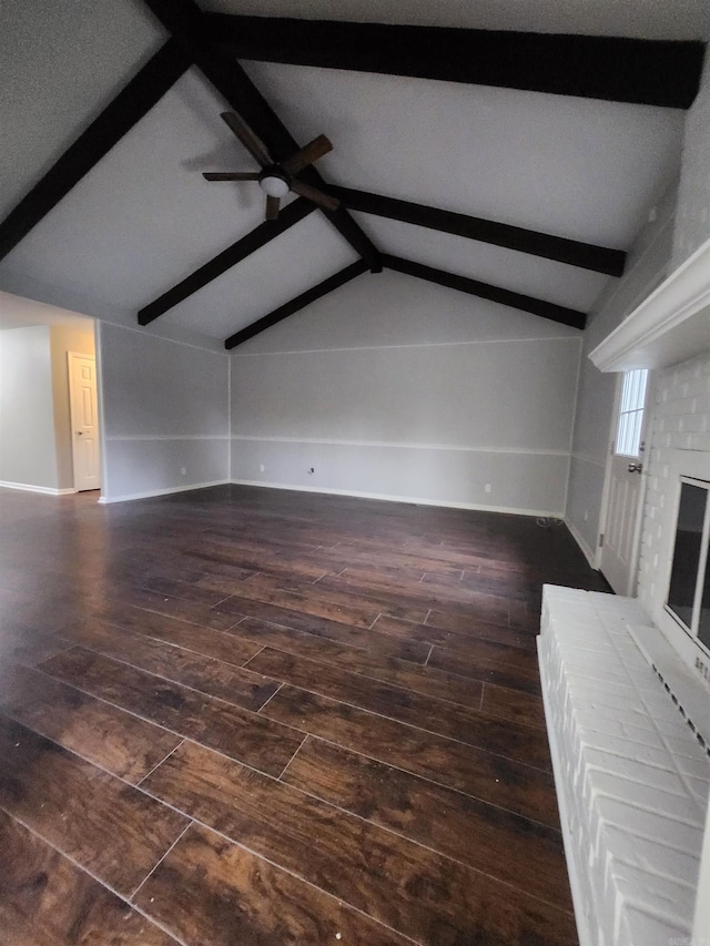 unfurnished living room with ceiling fan, dark wood-type flooring, and vaulted ceiling with beams