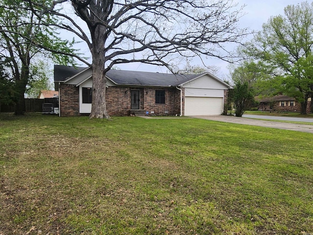 view of front of house with a garage and a front lawn