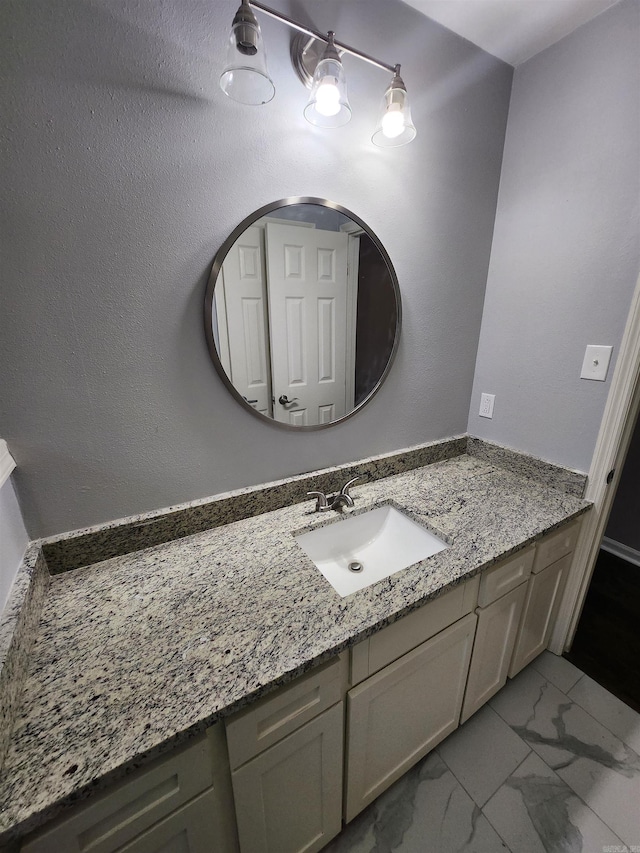 bathroom featuring large vanity and tile floors