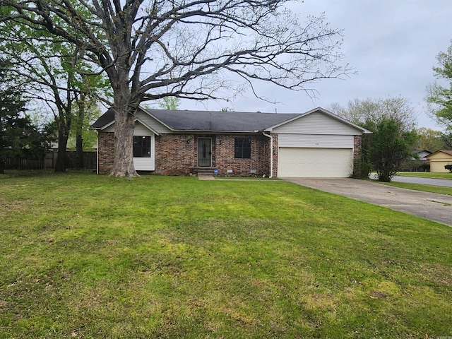 ranch-style house with a front yard and a garage