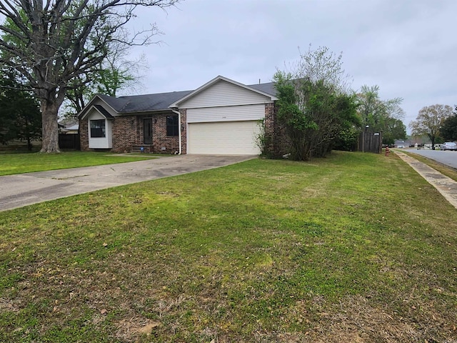 view of front of house featuring a garage and a front yard