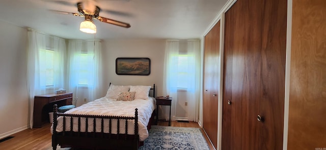 bedroom featuring ceiling fan and hardwood / wood-style flooring