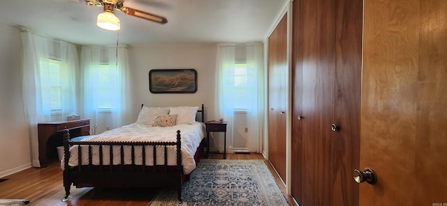 bedroom featuring wood-type flooring and ceiling fan