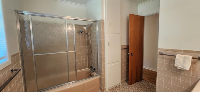 bathroom with tile walls, shower / bath combination with glass door, tile floors, and crown molding