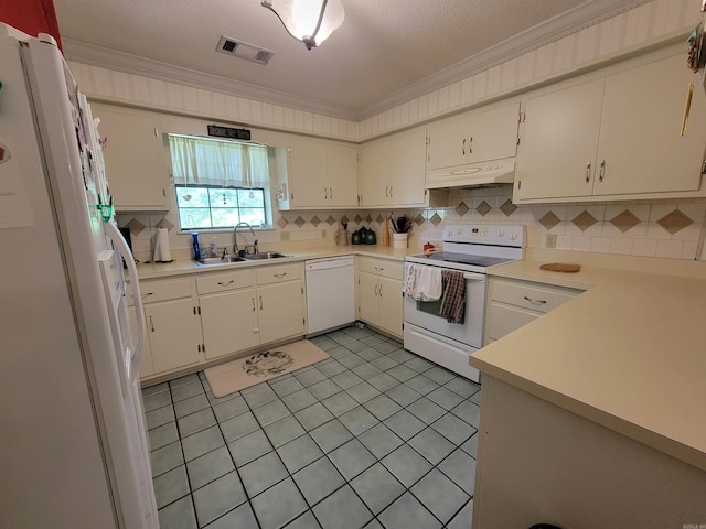 kitchen featuring crown molding, white appliances, sink, light tile patterned flooring, and decorative backsplash