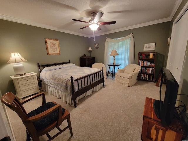 carpeted bedroom featuring a closet, ceiling fan, a textured ceiling, and ornamental molding