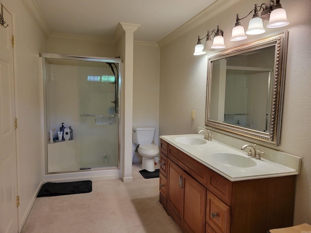 bathroom featuring vanity, toilet, ornamental molding, and an enclosed shower