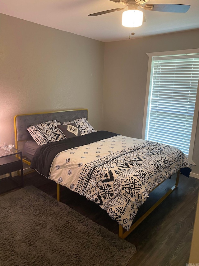 bedroom featuring ceiling fan and hardwood / wood-style floors