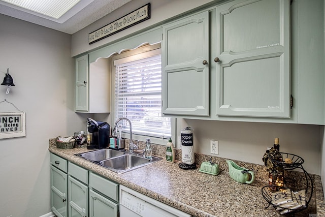 kitchen with white dishwasher and sink