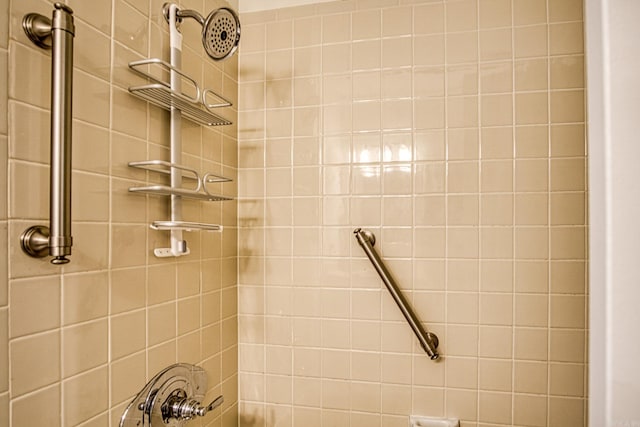 bathroom with a tile shower