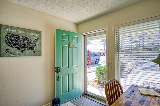 entrance foyer featuring a textured ceiling