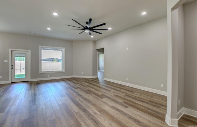 spare room featuring light wood-type flooring and ceiling fan