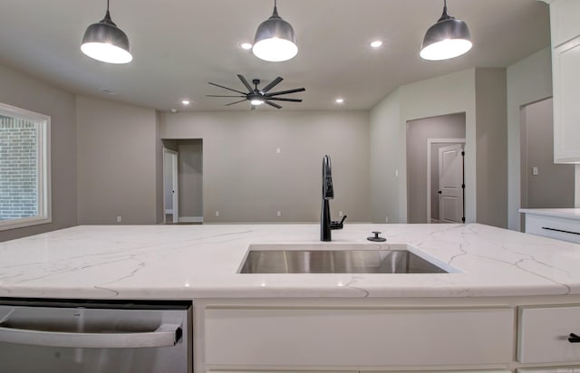 kitchen featuring dishwasher, white cabinetry, ceiling fan, and hanging light fixtures