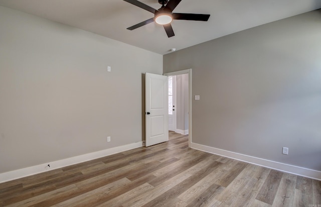 spare room with ceiling fan and light hardwood / wood-style floors