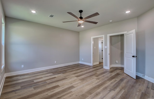 unfurnished bedroom with light hardwood / wood-style flooring and ceiling fan