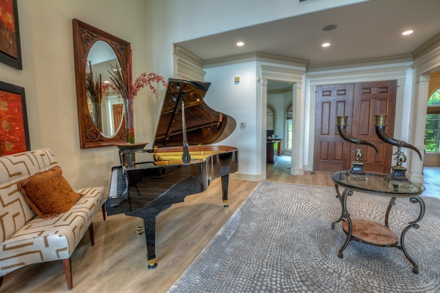 sitting room featuring hardwood / wood-style flooring and crown molding