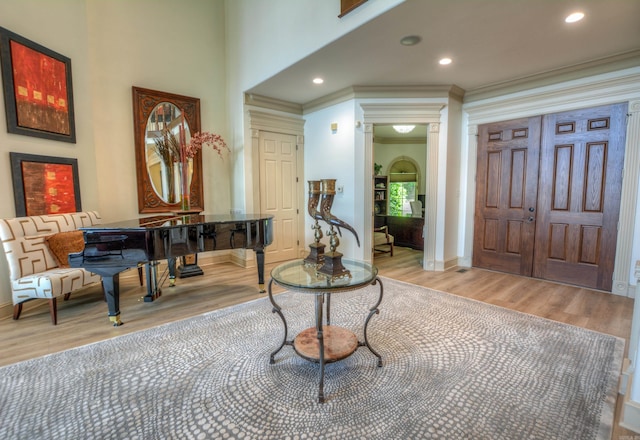 sitting room featuring ornamental molding and hardwood / wood-style floors