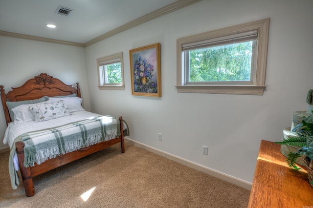 carpeted bedroom with ornamental molding