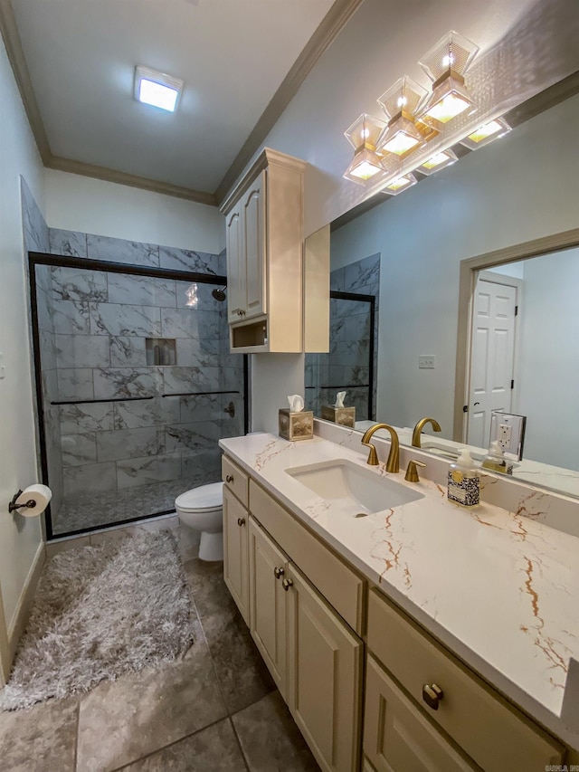 bathroom featuring a shower with shower door, toilet, vanity with extensive cabinet space, tile floors, and ornamental molding