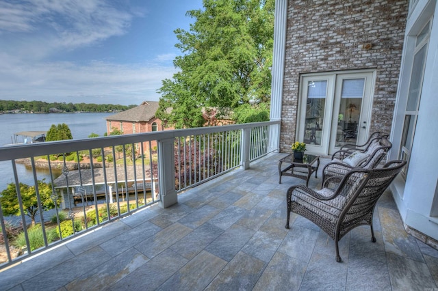 balcony featuring a water view