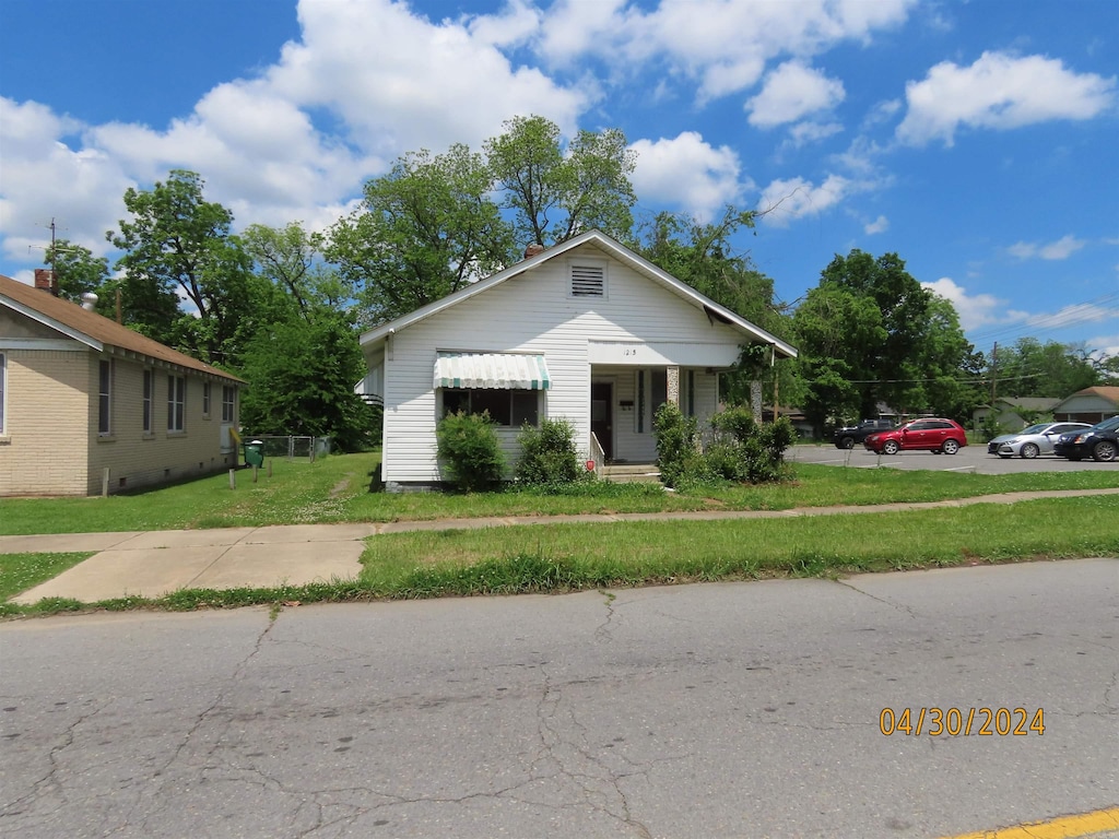 bungalow with a front lawn