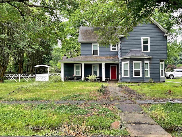 front facade with a front yard