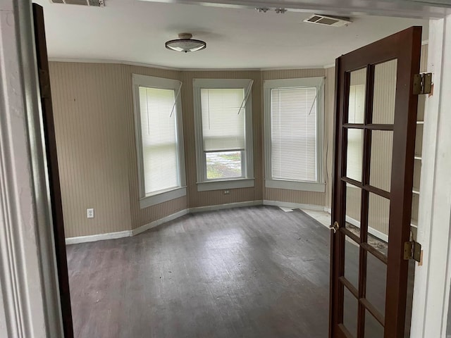 empty room with hardwood / wood-style flooring