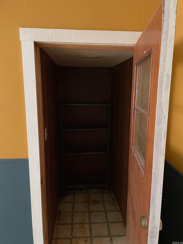 hallway featuring tile flooring