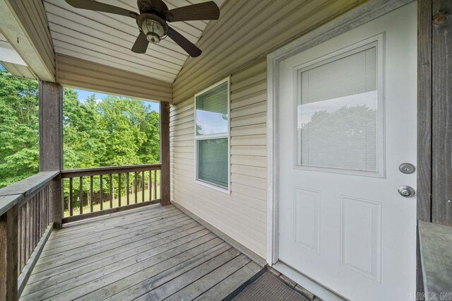 wooden terrace featuring ceiling fan