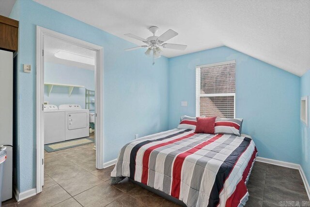 tiled bedroom featuring washer and clothes dryer, ceiling fan, a textured ceiling, and lofted ceiling