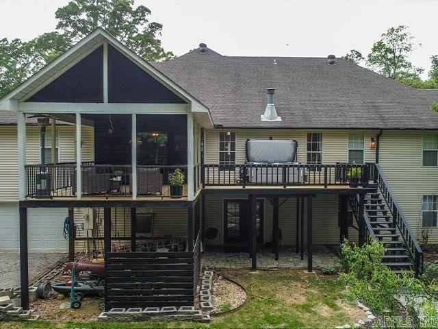 back of house featuring a deck