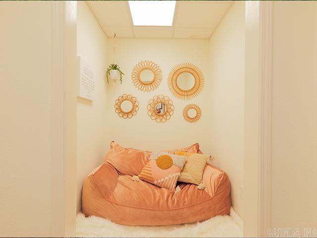 sitting room featuring a drop ceiling