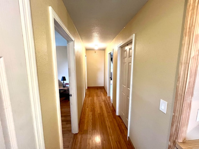 hallway featuring hardwood / wood-style floors