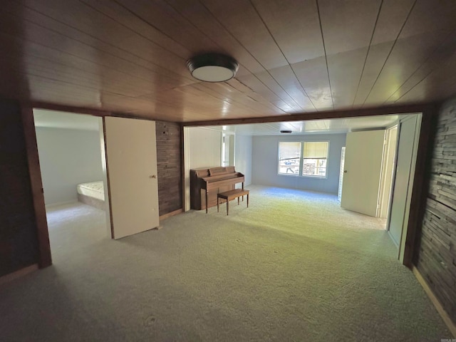 basement featuring wood ceiling and carpet floors