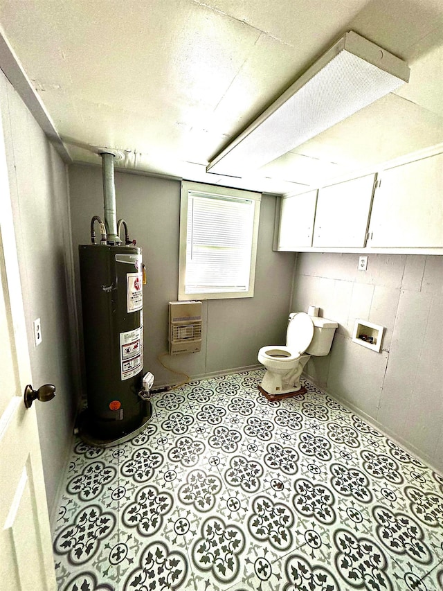 utility room featuring water heater