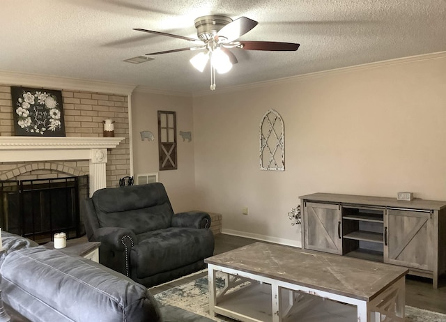 living room with ceiling fan, a fireplace, a textured ceiling, brick wall, and hardwood / wood-style flooring