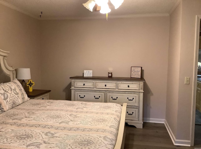 bedroom with ceiling fan, dark hardwood / wood-style flooring, and a textured ceiling