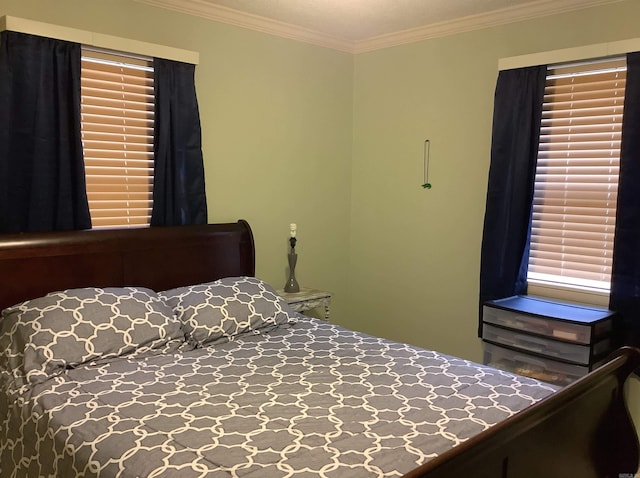 bedroom featuring crown molding