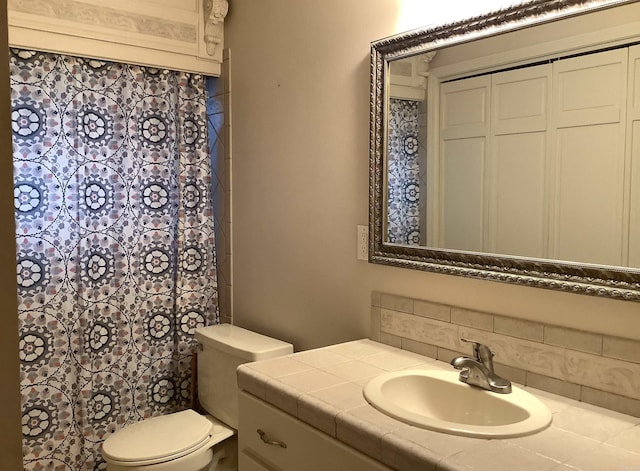 bathroom with oversized vanity and toilet