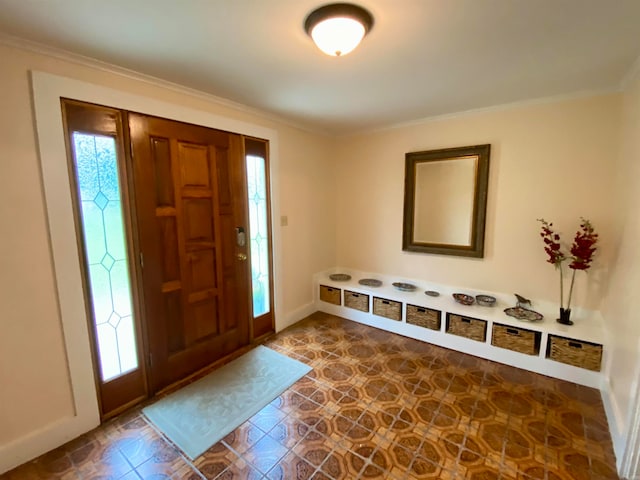 tiled entrance foyer featuring plenty of natural light and ornamental molding