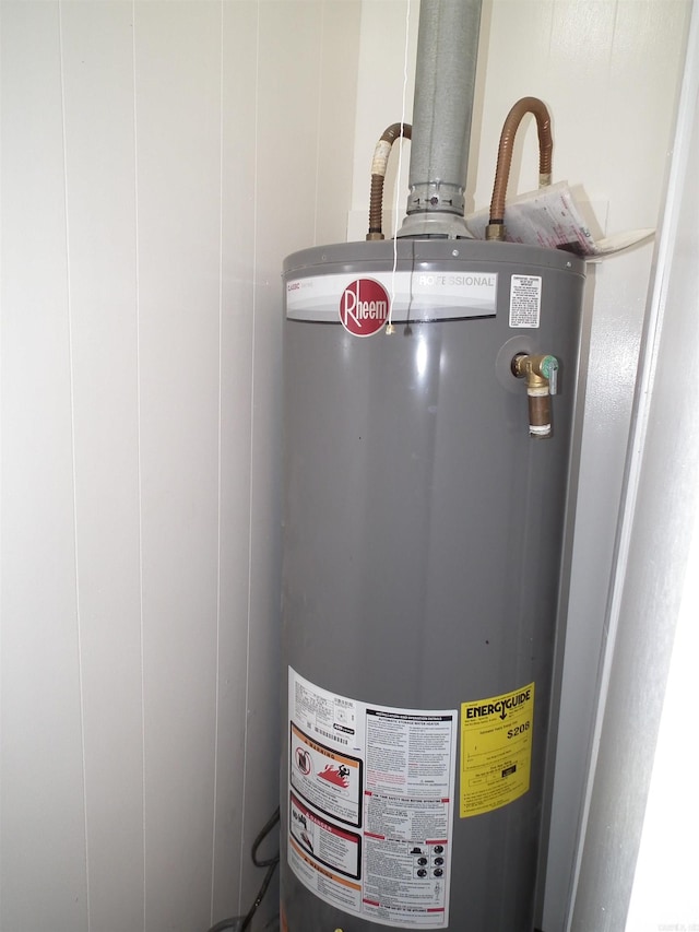 utility room with gas water heater