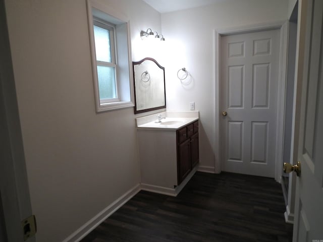 bathroom featuring wood-type flooring and vanity